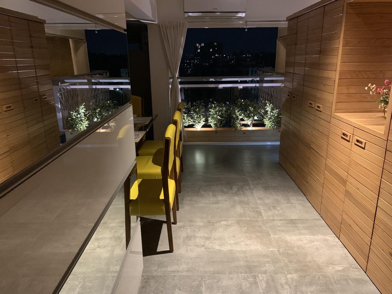 Balcony garden and dining nook at night