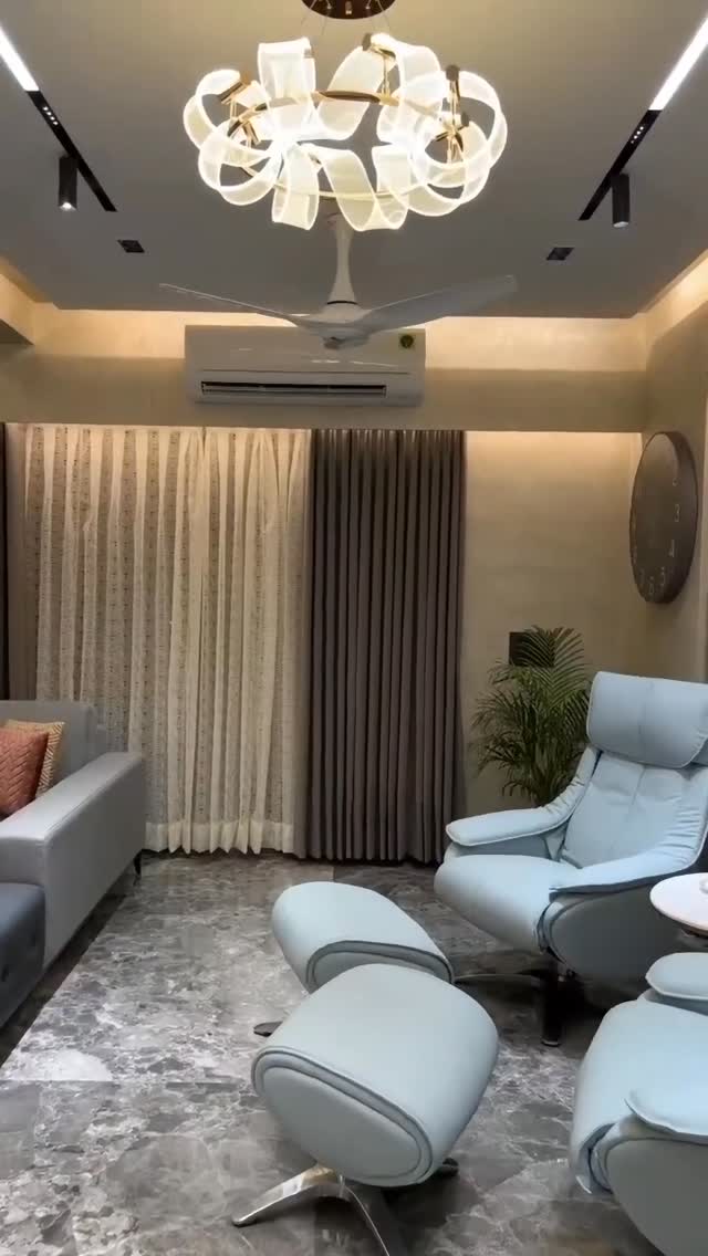 Wellness retreat living room with sculptural chandelier
